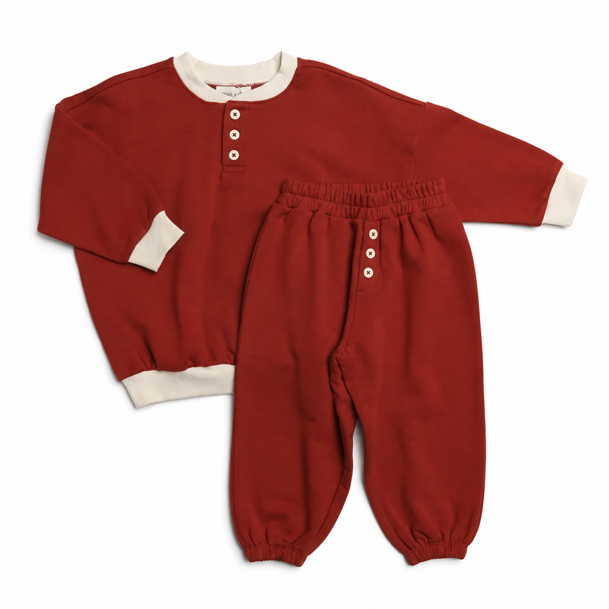 Bailey two-piece French terry set in Clay Red with ivory trim by Winnie + Crew.