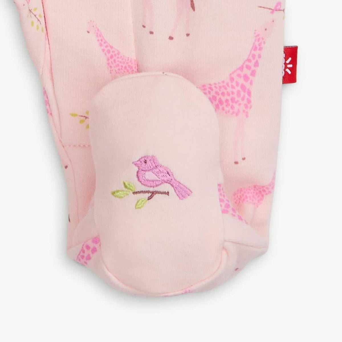 Pink Jolie Giraffe footie with embroidered foot detail.