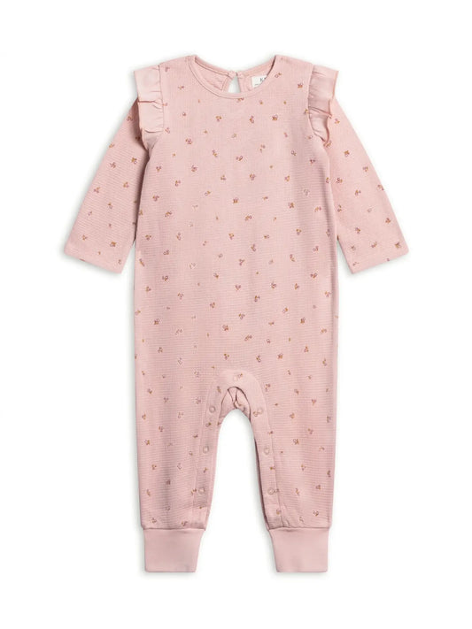 Pink Colored Organics Mila waffle knit romper in Tilda Floral with long sleeves, flutter shoulders and cuffed ankles.