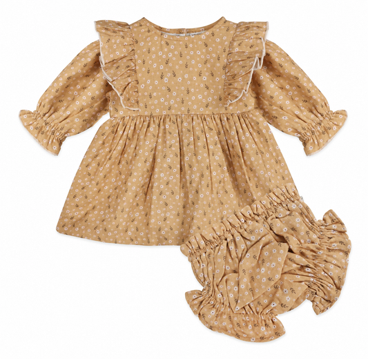 Mustard floral organic muslin baby dress with ruffled shoulders and long puff sleeves with matching bloomers by Viverano Organics.