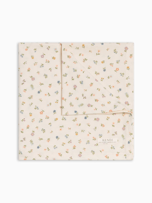 Colored Organics Petaline Floral organic cotton swaddle blanket in cream.