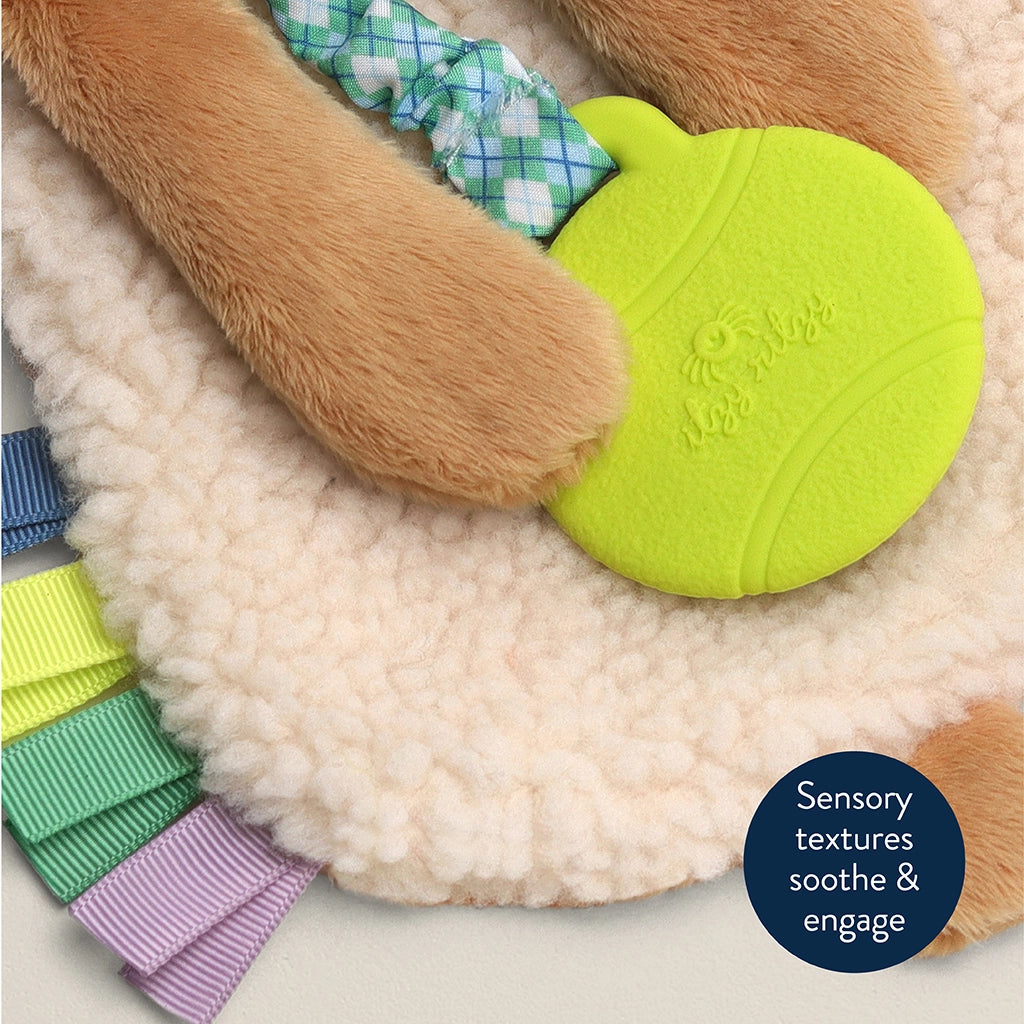 Close-up of the textured silicone teether on the puppy lovey.