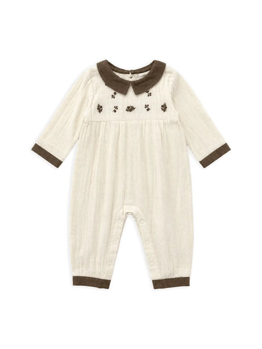 Viverano Organics Sweet Cream embroidered crinkle muslin baby jumpsuit with brown corduroy trim. 