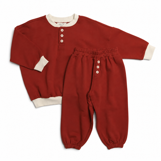 Bailey two-piece French terry set in Clay Red with ivory trim by Winnie + Crew.