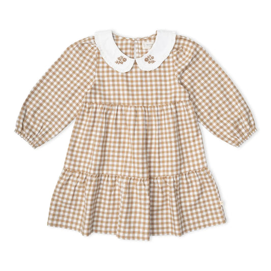 Makemake Organics Organic Collar Tiered Dress in Oat Gingham with long sleeves, a tiered skirt, and embroidered white collar.