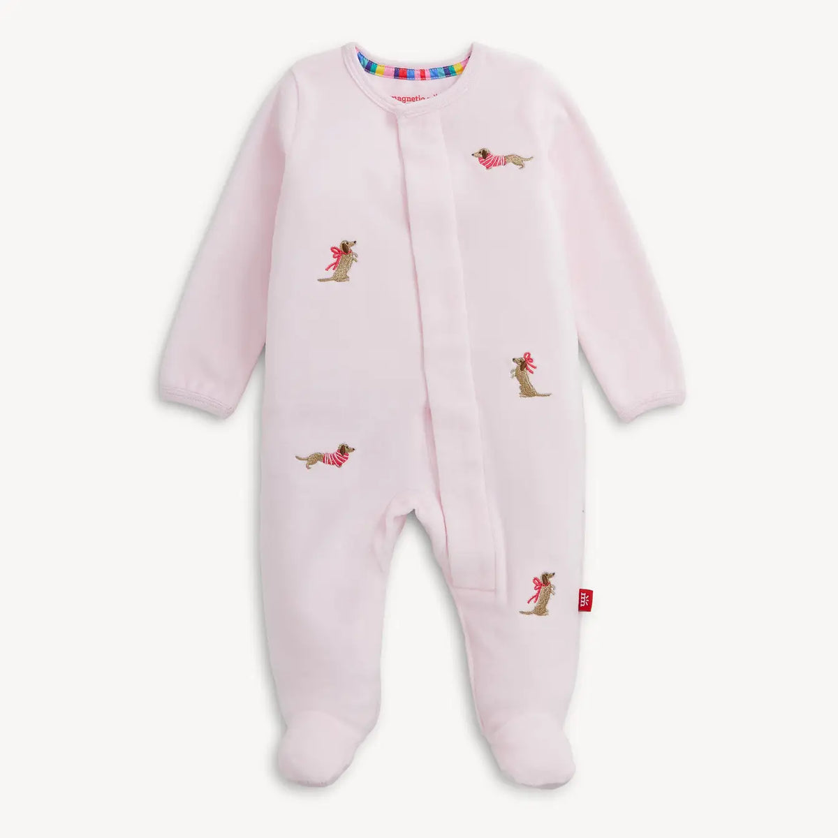 Pink Magnetic Me velour baby footie with playful embroidered dogs.