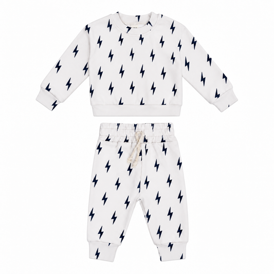 Off-white toddler jogger set with black lightning bolt print by Lucky Panda Kids.