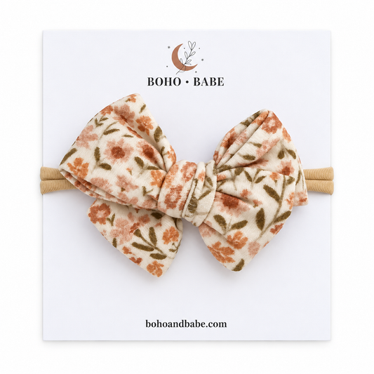 Floral Garden layered bow baby headband with tan nylon band.