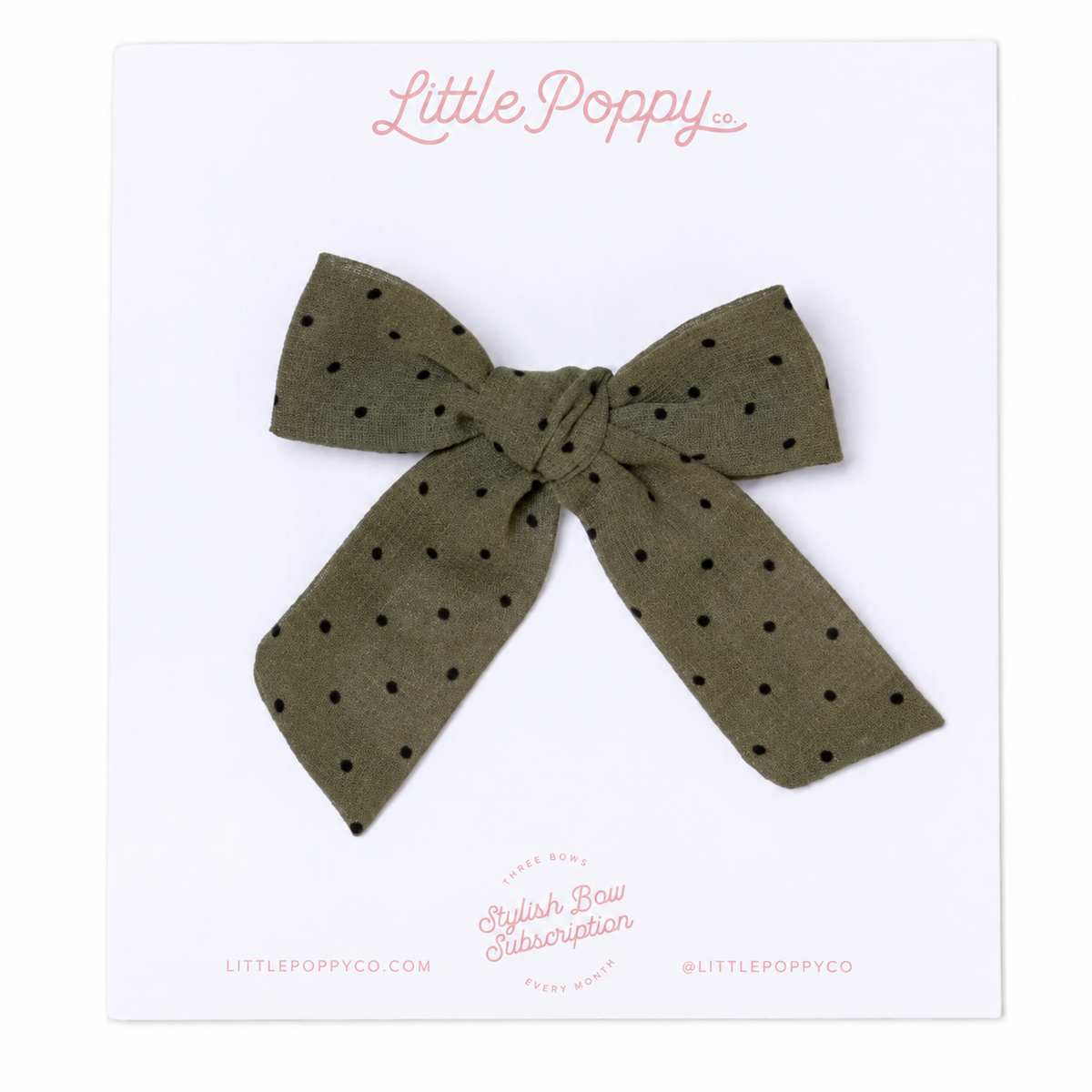 An olive green chiffon bow with black polka dots and an alligator clip on the back.