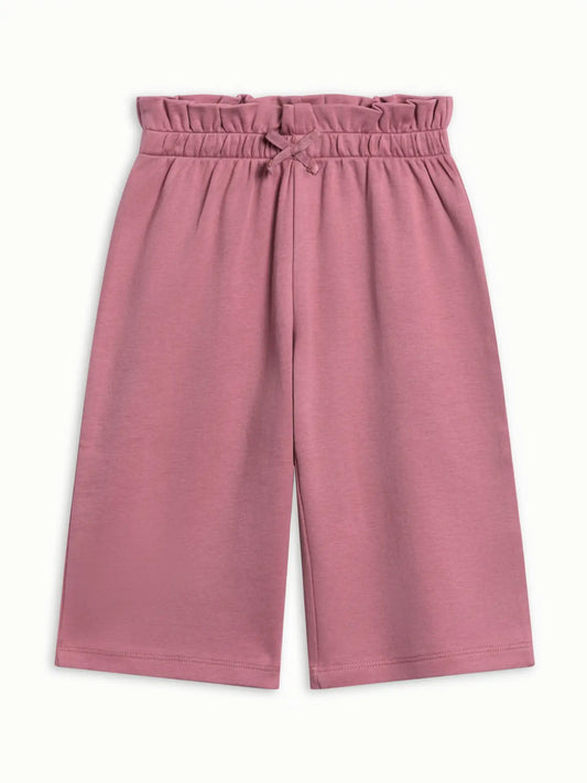 Colored Organics Mari Ruffle Waist Pants in Bloom dusty rose, featuring a ruffled waistband, bow detail, and straight legs.
