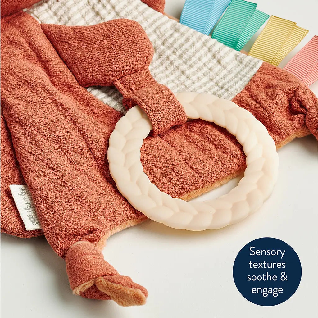 Close-up of the braided teething ring and textured ribbons on the Fox Bitzy Crinkle.